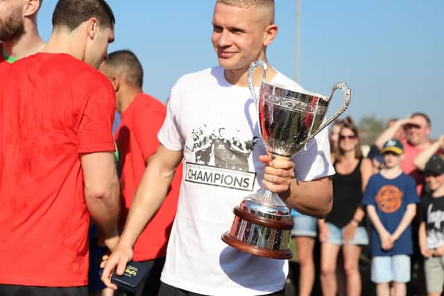 Kettering Town's players enjoy their title party