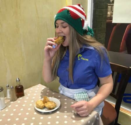 Chip shop worker Alice tries the deep fried treats for the first time - and she loved them! Credit: Adam Smith NNL-171123-124848005