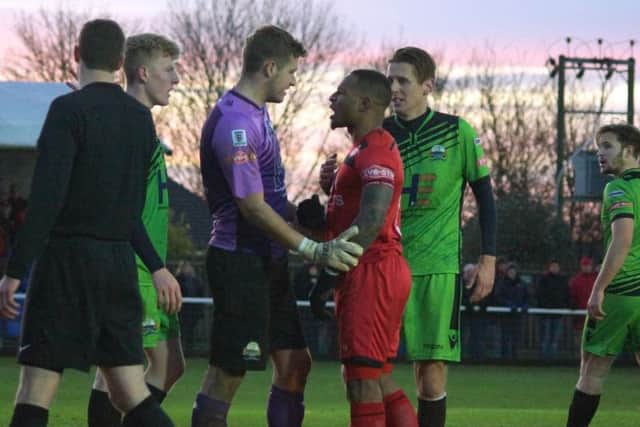 Aaron O'Connor exchanges words with some of the Gosport players