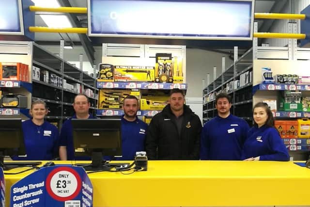 Kieran with staff at the store. NNL-171129-115404005