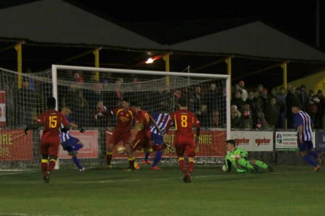 Lindon Meikle scores Kettering Town's goal in their 1-1 draw at Banbury United. Pictures by Peter Short