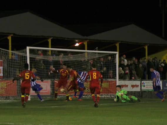 Lindon Meikle scores Kettering Town's goal in their 1-1 draw at Banbury United. Pictures by Peter Short