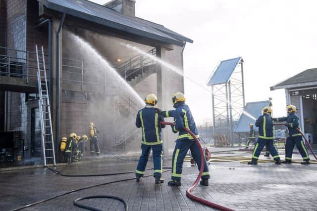 As part of the passing out event, the new recruits demonstrated their firefighting skills NNL-170112-102403005
