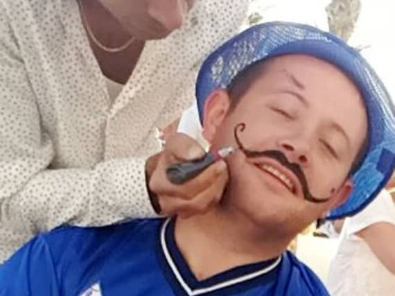 Arran Maye in Benidorm where he had the henna moustache.