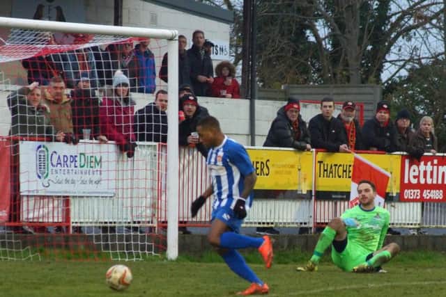 Aaron O'Connor gets round Frome Town goalkeeper Kyle Phillips to score his and Kettering Town's first goal in the 2-2 draw. Pictures by Peter Short