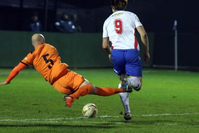 Hartley Wintney's Steve Noakes was sent-off for this challenge on Tom Lorraine
