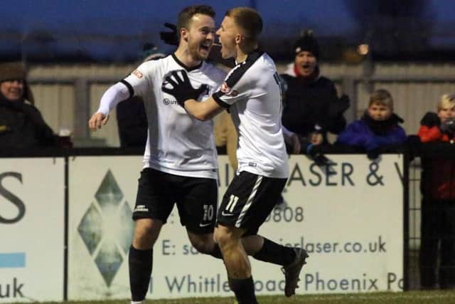 Sam Mulready celebrates with Jordon Crawford after the former scored Corby Town's winner in the 2-1 success over Leek Town at Steel Park. Pictures by Alison Bagley
