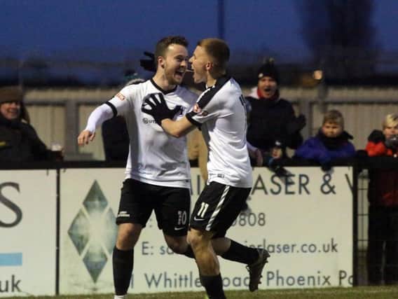Sam Mulready celebrates with Jordon Crawford after the former scored Corby Town's winner in the 2-1 success over Leek Town at Steel Park. Pictures by Alison Bagley