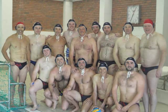 Roger and his water polo squad. NNL-171212-133637005