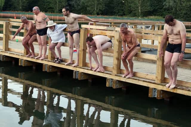 Wicksteed Lake: Kettering: Wicksteed Parkâ¬"s newly restored lake hosts Kettering Amateur Swimming Club for their anniversary celebration swim.
Present members of the club recreate a 1920s photo of KASC members about to jump into Wicksteed Lake.
l-r John Withpetersen, Tom Reed, Don Ward (president), Allan Withpetersen, Richard Harmer, Roger Patrick, Rob Mitchell
Thursday 17th July 2014 NNL-171212-133651005