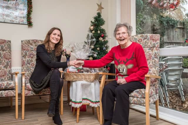 Marguerite receiving her gift from the Longhurst Group