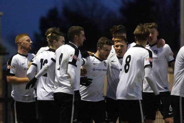 The Corby Town players celebrate Sam Mulready's winner in last weekend's 2-1 success over Leek Town at Steel Park. Picture by Alison Bagley