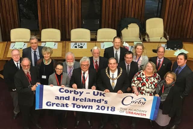 Corby councillors celebrate with the new banner. NNL-171218-154337005