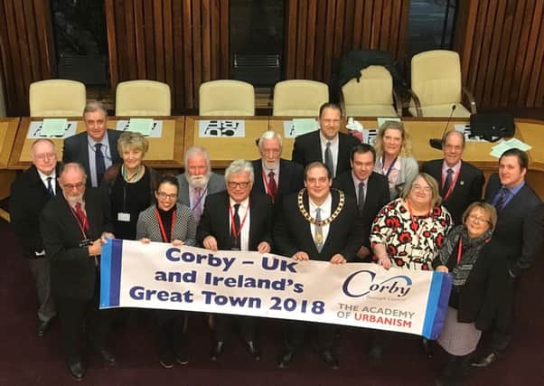 Corby councillors celebrate with the new banner. NNL-171218-154337005