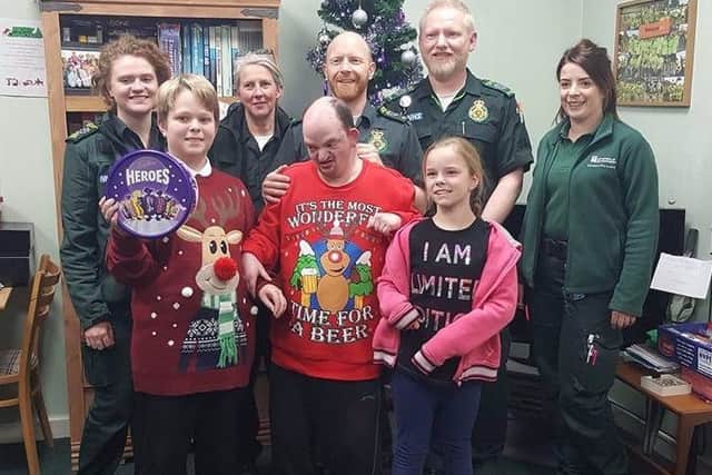 The family giving some chocolates to staff at Corby ambulance station