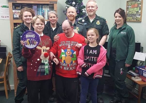 The family giving some chocolates to staff at Corby ambulance station