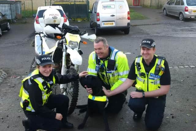 Members of the Northampton Neighbourhood Police Team with Chandler the guide dog.