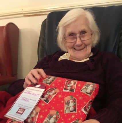 Doris, ex-land girl, receiving her gift