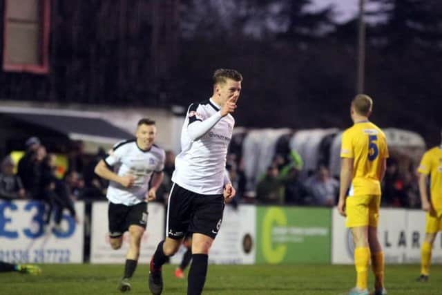 Cameron Healey celebrates after he put Corby Town 2-1 up at Steel Park