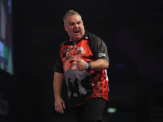 James Richardson celebrates during his win over Alan Norris yesterday. Picture courtesy of Lawrence Lustig/PDC