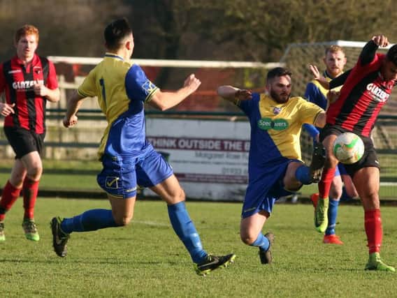 Action from the goalless draw between Wellingborough Town and Whitworth on Boxing Day. Picture by Alison Bagley