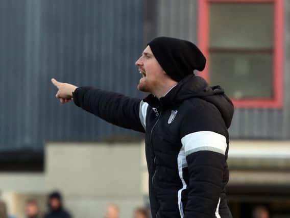 Steve Kinniburgh wants a reaction from his Corby Town players when they start 2018 with a home clash against Bedworth United this afternoon