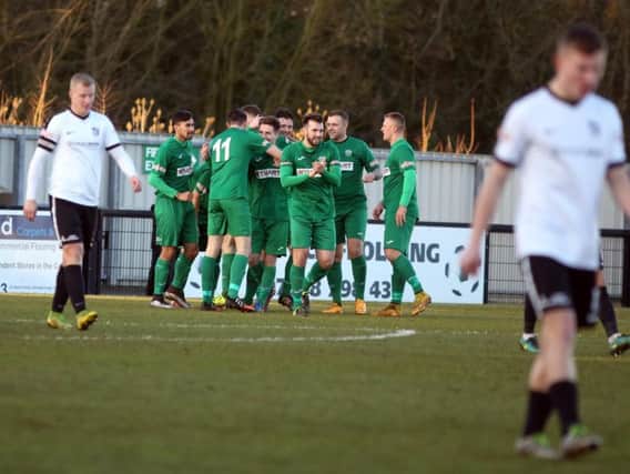 Bedworth United celebrate scoring the only goal of the game as they condemned Corby Town to a third defeat in a row. Picture by Alison Bagley
