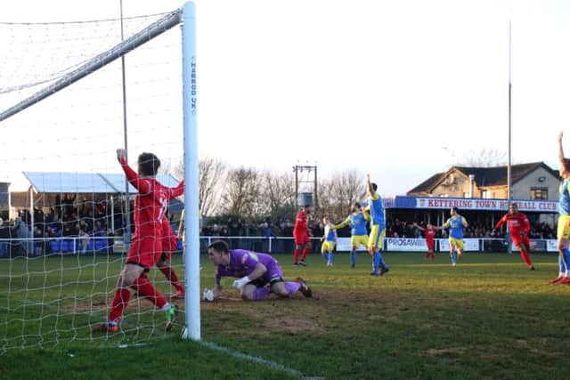 The celebrations begin as Aaron O'Connor grabs the only goal of the game to give Kettering Town a 1-0 success over promotion rivals King's Lynn Town at Latimer Park. Pictures by Peter Short