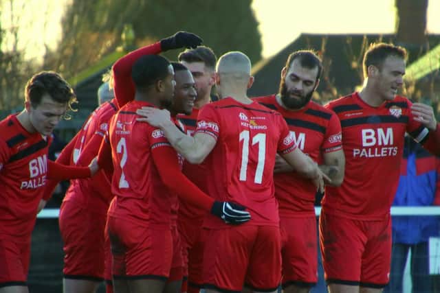 The Poppies players celebrate Aaron O'Connor's first-half goal