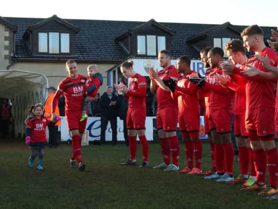Brett Solkhon was given a guard of honour by his team-mates and the King's Lynn Town players ahead of his 500th appearance for Kettering Town on New Year's Day. Picture by Peter Short