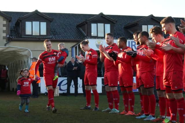 Brett Solkhon was given a guard of honour by his team-mates and the King's Lynn Town players ahead of his 500th appearance for Kettering Town on New Year's Day. Picture by Peter Short