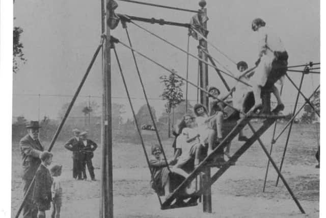 An early fairground swing. NNL-180501-151037005