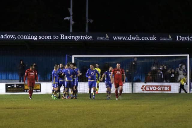 Basingstoke Town's players celebrate one of their goals as Kettering Town slipped to a 3-2 defeat. Pictures by Peter Short