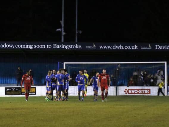 Basingstoke Town's players celebrate one of their goals as Kettering Town slipped to a 3-2 defeat. Pictures by Peter Short
