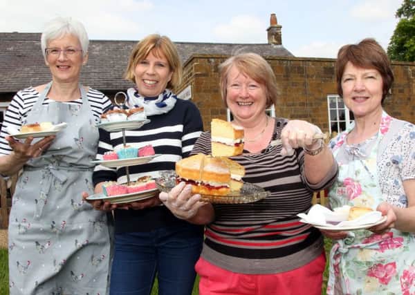 Taken in 2014, WI members Ann Cotton, Monique Shortt, Kate Earley and Heather Piper serving tea and cakes to the bluebell walkers in Badby