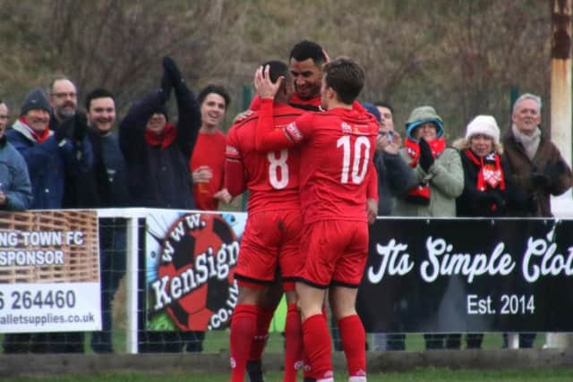 Aaron O'Connor is congratulated by Rene Howe and Ben Milnes after his goal