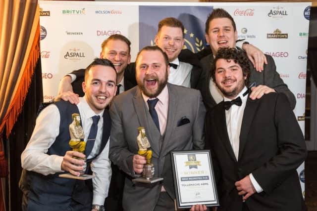 The Tollemache Arms celebrate with their awards. NNL-180117-144312005