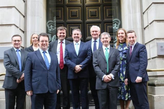 Tom Pursglove (far right) with Liam Fox (centre). NNL-180118-113713005