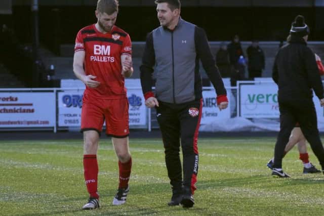 Boss Marcus Law and Gary Mulligan share a joke after the final whistle