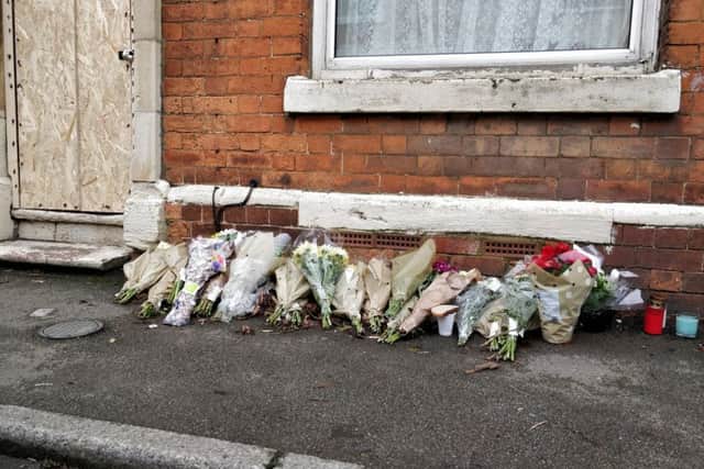 Flowers left outside Tairu Jallow's house. NNL-180123-154022005