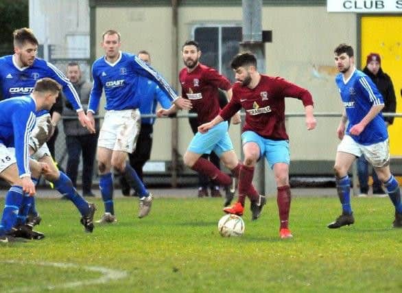 Action from Rothwell Corinthians' 4-1 defeat at Deeping Rangers in the UCL Premier Division last weekend