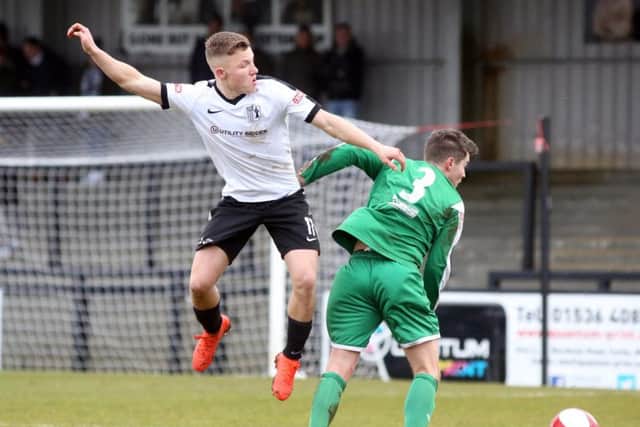 Jordon Crawford challenges a Frickley opponent
