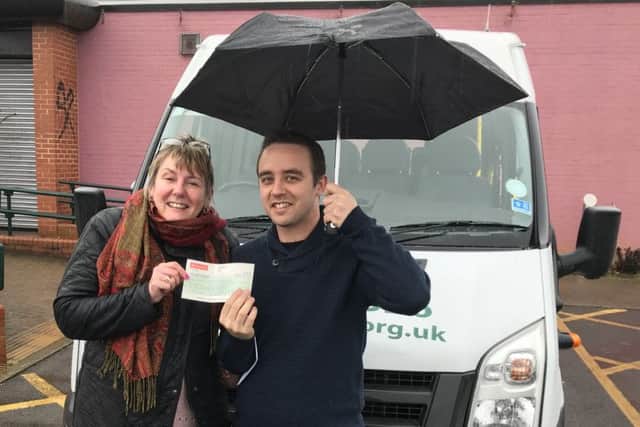 Karl handing over the cheque to Heather Saunders from Glamis Hall