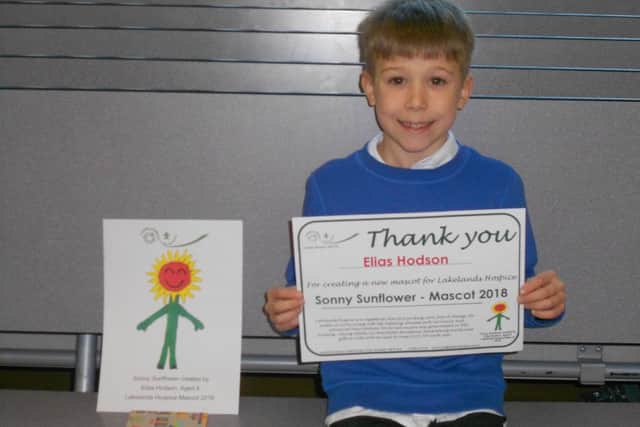 Elias Hodson with his certificate