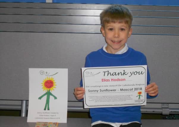 Elias Hodson with his certificate