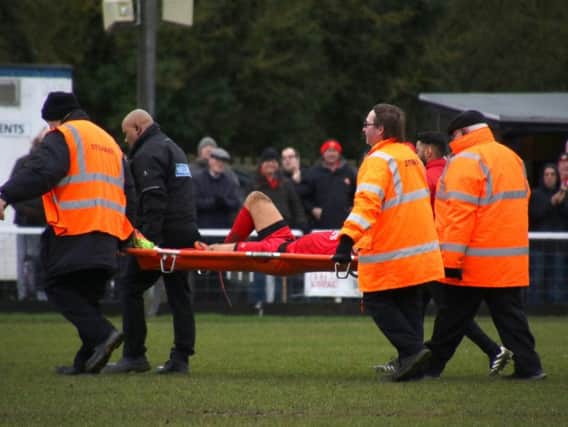 Ben Milnes is stretchered off with what turned out to be ankle ligament damage during Kettering Town's 3-1 victory over Biggleswade Town last weekend. Picture by Peter Short
