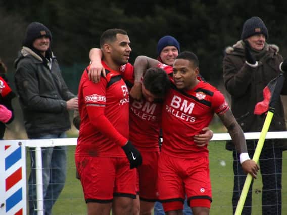 Goalscorer Mathew Stevens (centre) is congratulated by Rene Howe and Aaron O'Connor after he gave the Poppies the lead in their 3-1 win over Biggleswade Town last weekend. Picture by Peter Short