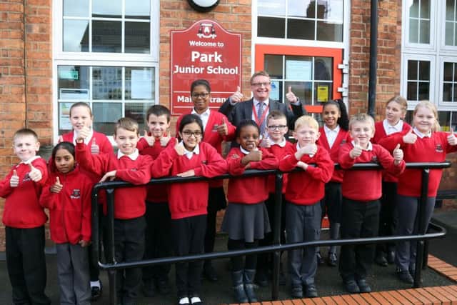 Pupils celebrating the recent Ofsted inspection with headteacher David Tebbutt