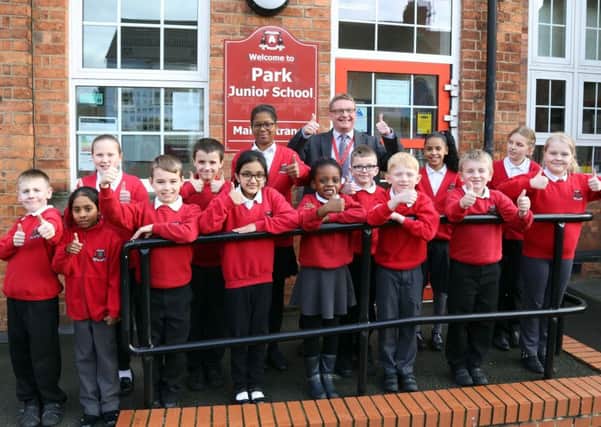 Pupils celebrating the recent Ofsted inspection with headteacher David Tebbutt