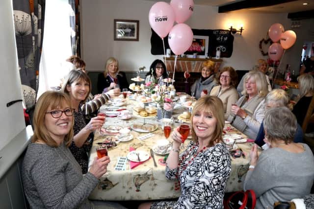 Women enjoy the charity afternoon tea. NNL-180602-154924005